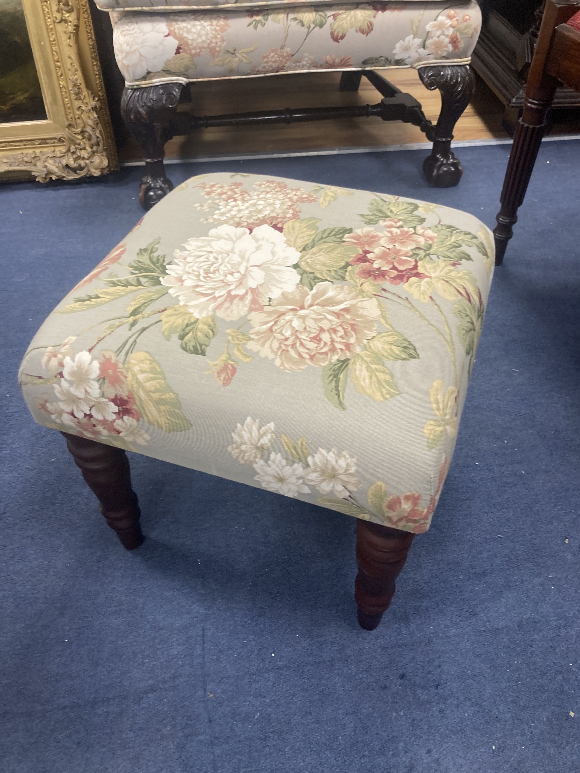 A Chippendale revival wing armchair together with a matching contemporary footstool